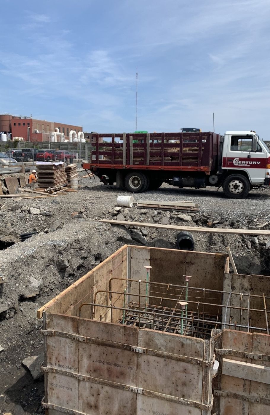 Century Concrete truck beside a formed pier with rebar