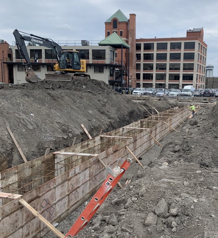 Long formed grade beam with rebar on a city site