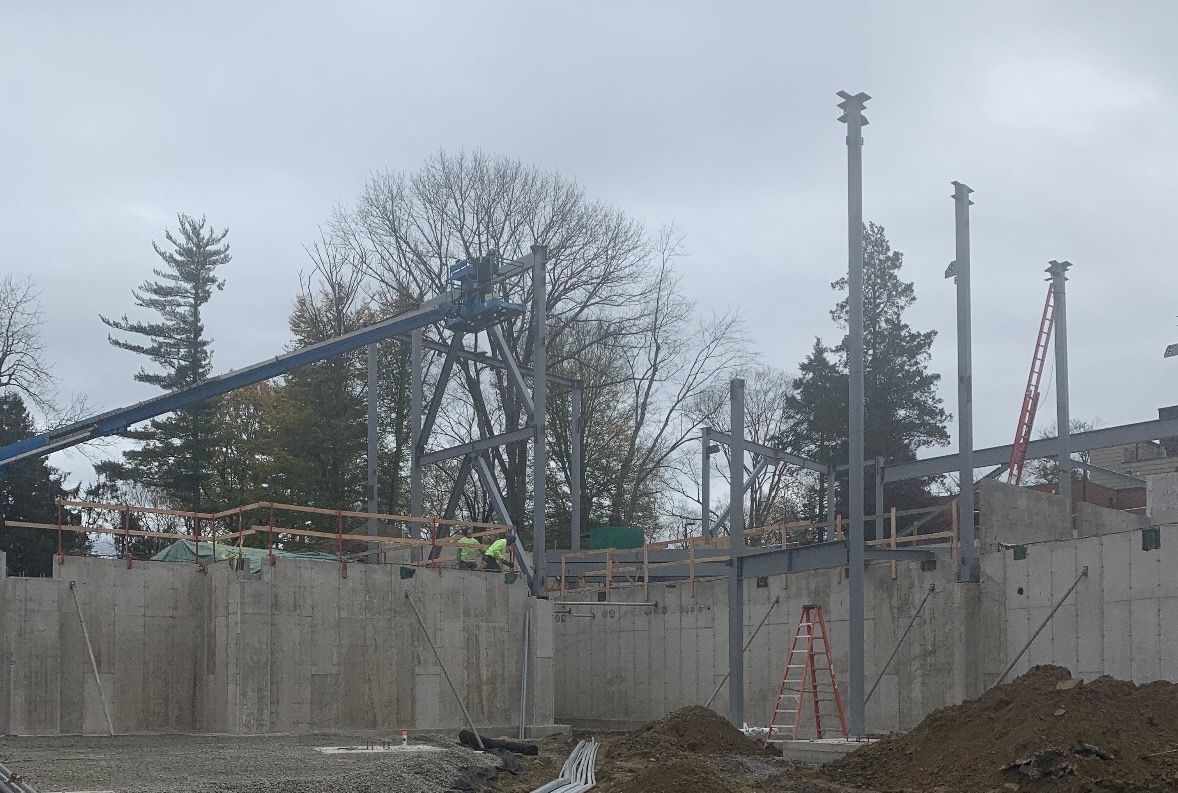 Finished foundation walls with steel framing going up